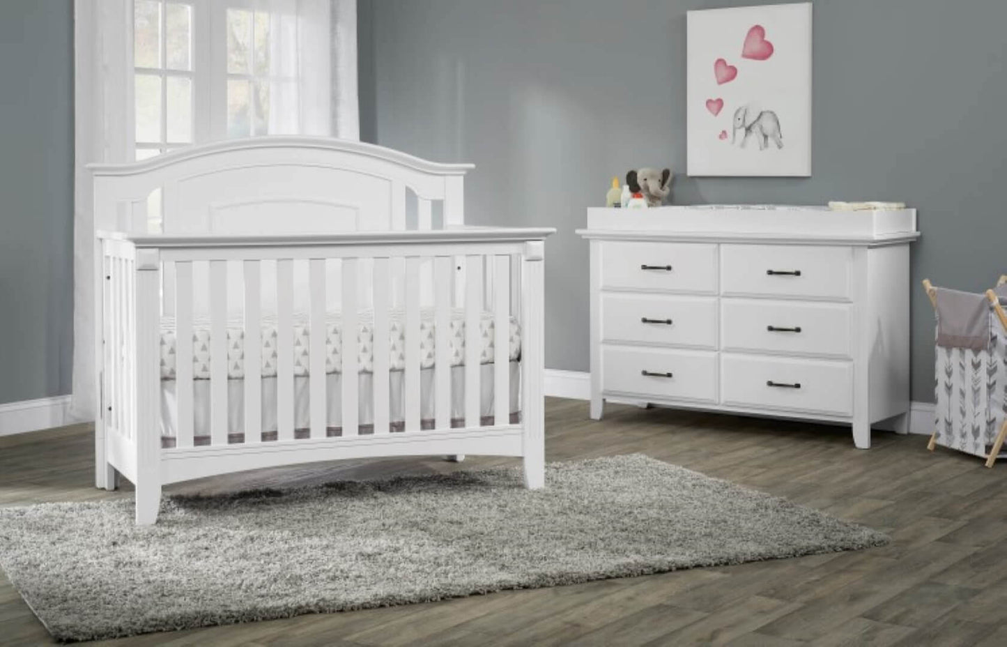 Willowbrook 4-in-1 Convertible Crib - Lifestyle Image Inclined Side View of Willowbrook 4-in-1 Convertible Crib White