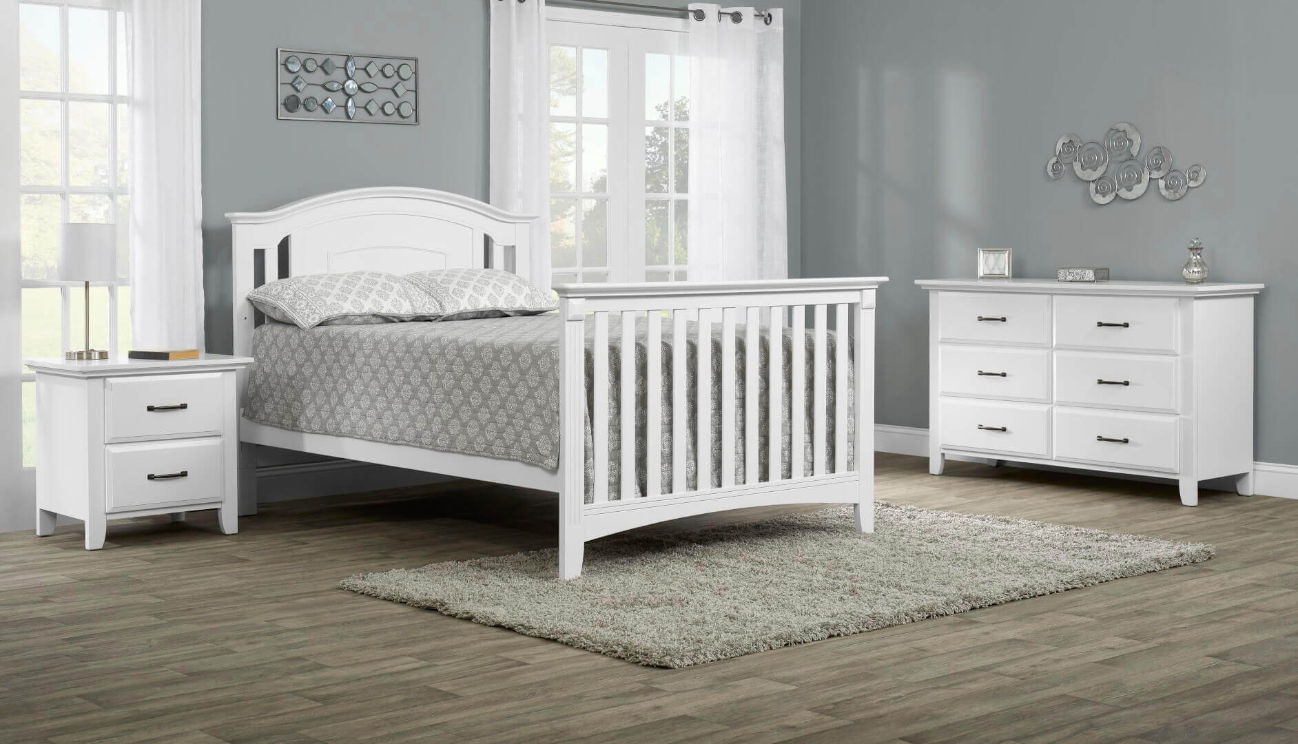 Willowbrook 4-in-1 Convertible Crib - Lifestyle Image Inclined Side View of Willowbrook Full Sized Bed White