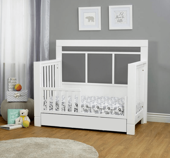 Crystal Convertible Crib - Lifestyle Image Inclined Side View of Crystal Convertible Crib with Guard Rail Multi Tone Gray