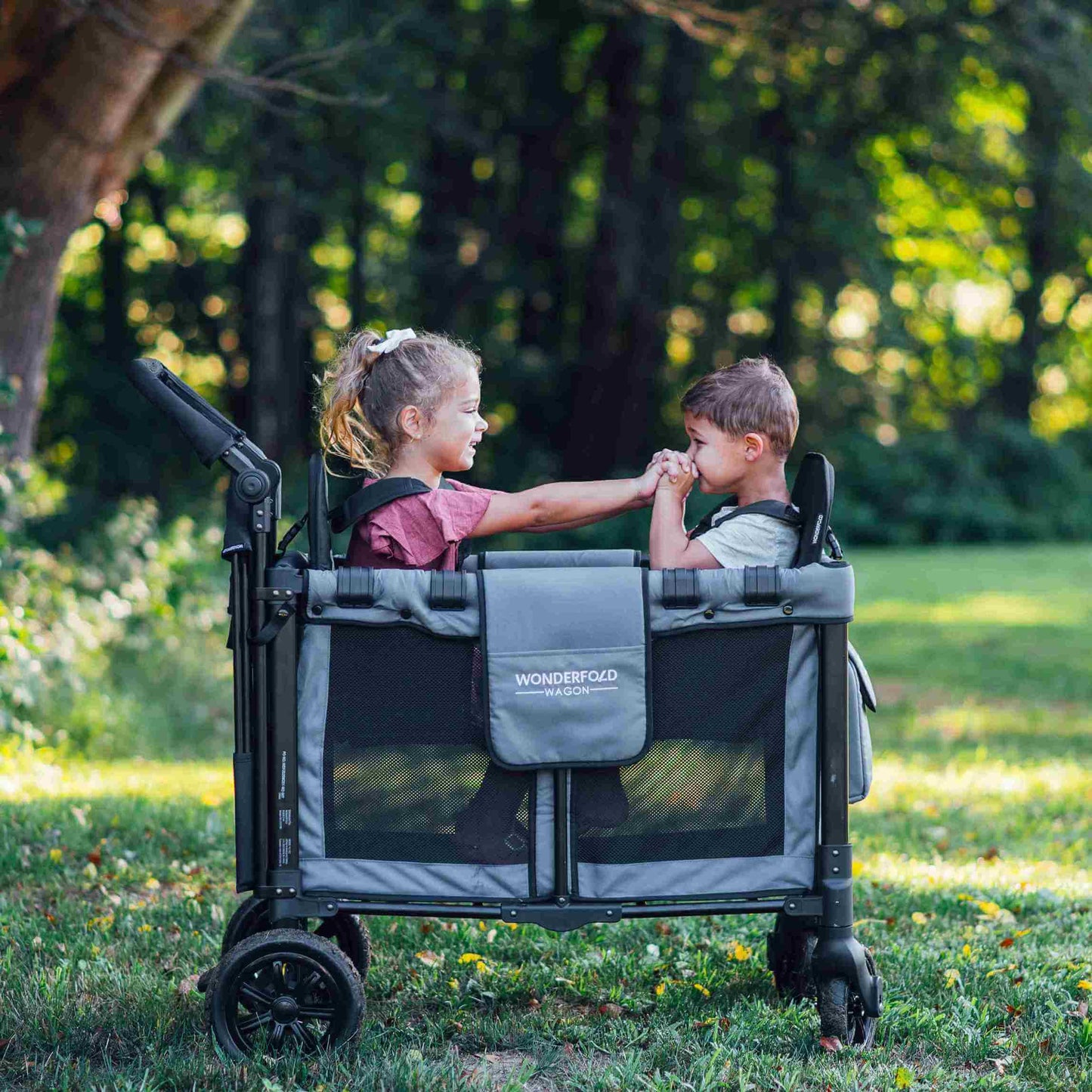 W2 Original + Double Stroller Wagon - Lifestyle Image of Toddler Playing on W2 Original + Double Stroller Wagon Gray
