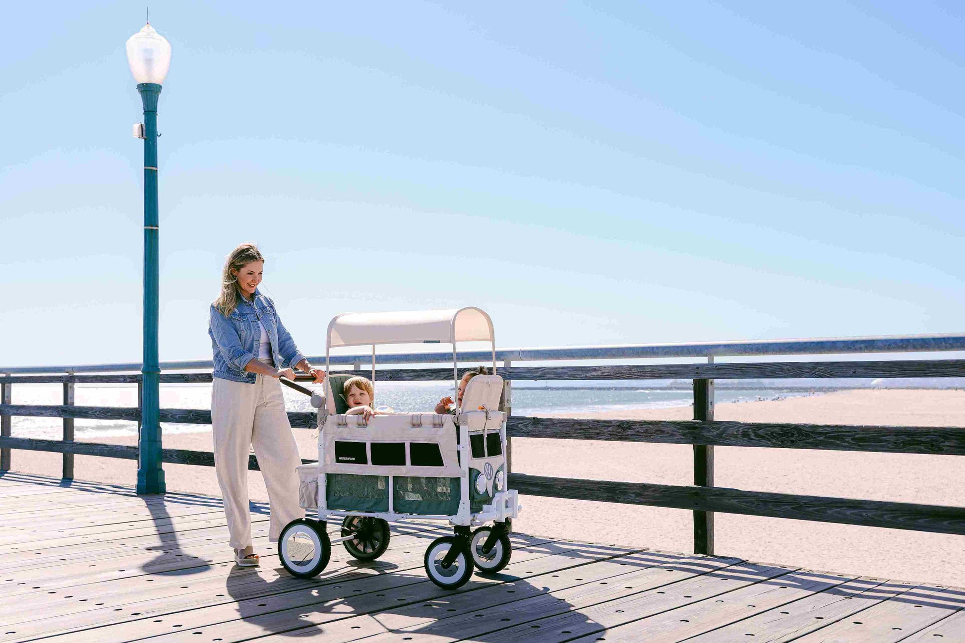 VW2 Volkswagen Stroller Wagon - Lifestyle Image Side View of Wagon Green