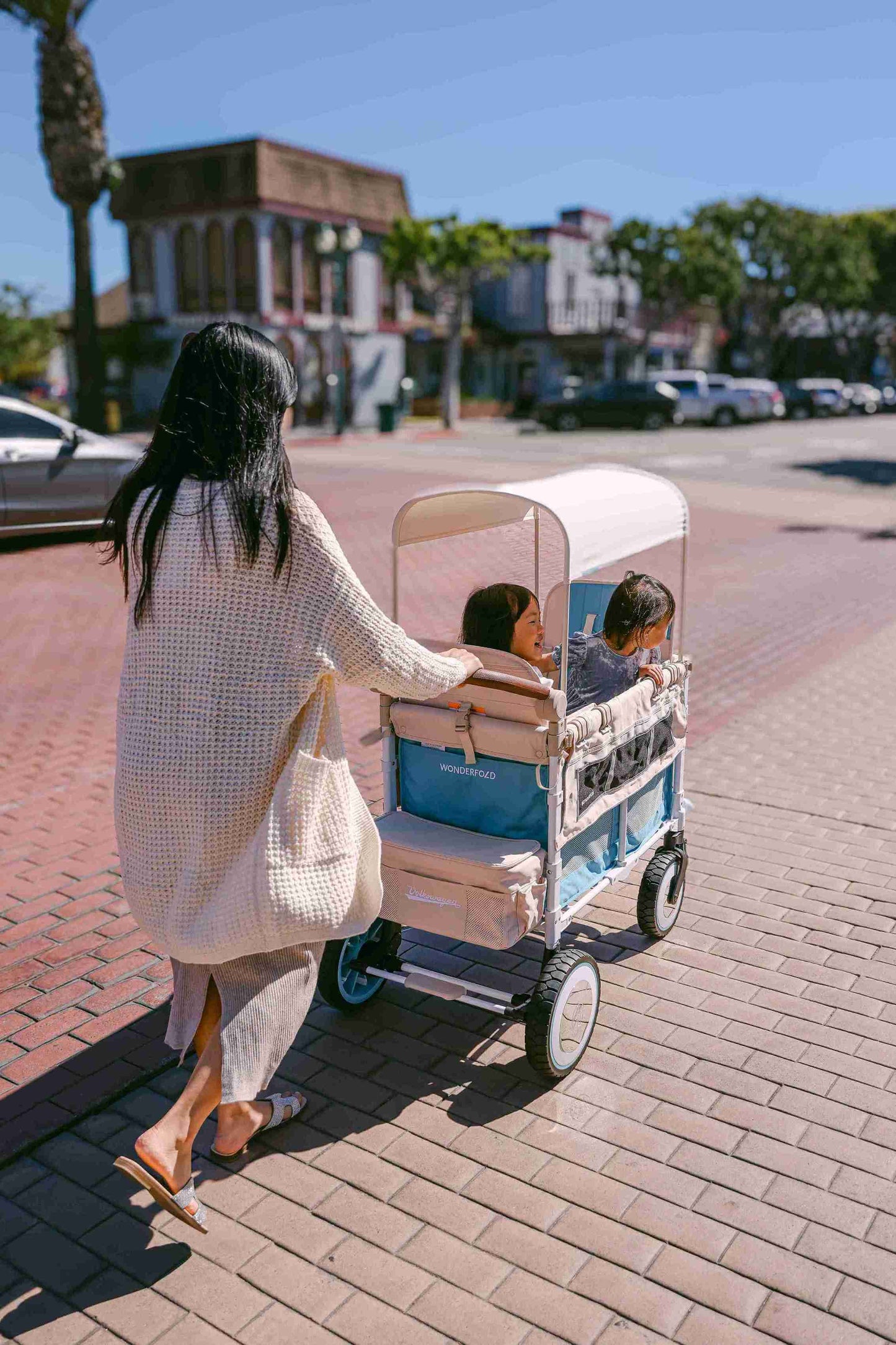 VW2 Volkswagen Stroller Wagon - Lifestyle Image Back View of Wagon Green