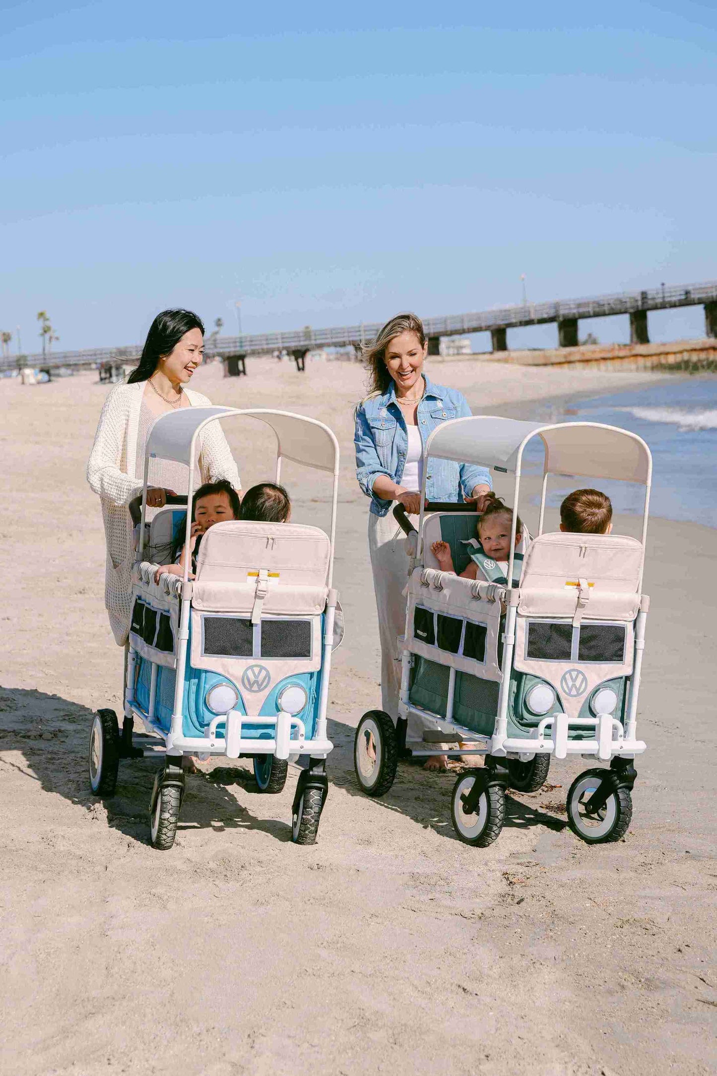 VW2 Volkswagen Stroller Wagon - Lifestyle Image Inclined Front View of Wagon Blue and Green