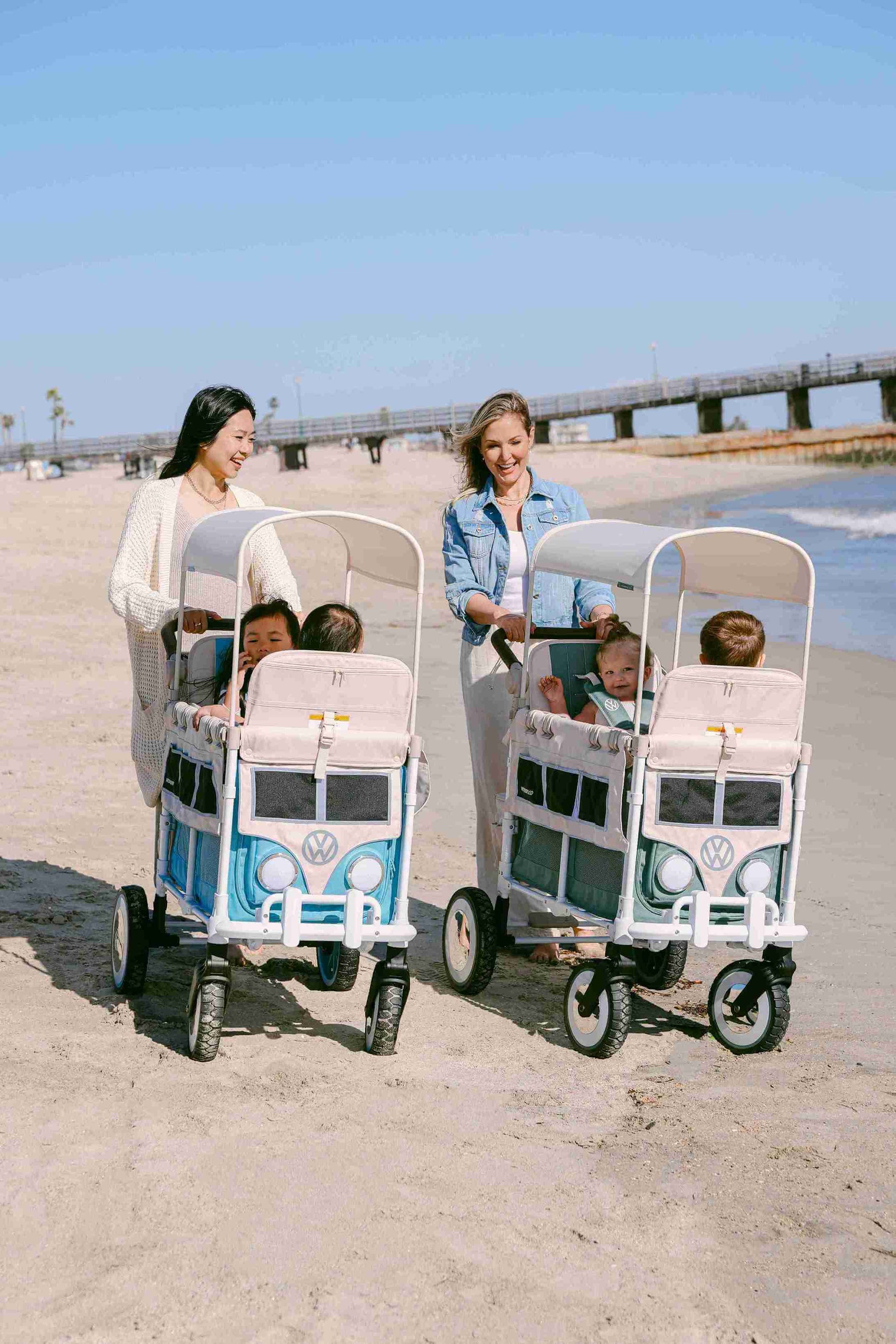 VW2 Volkswagen Stroller Wagon - Lifestyle Image Inclined Front View of Wagon Blue and Green