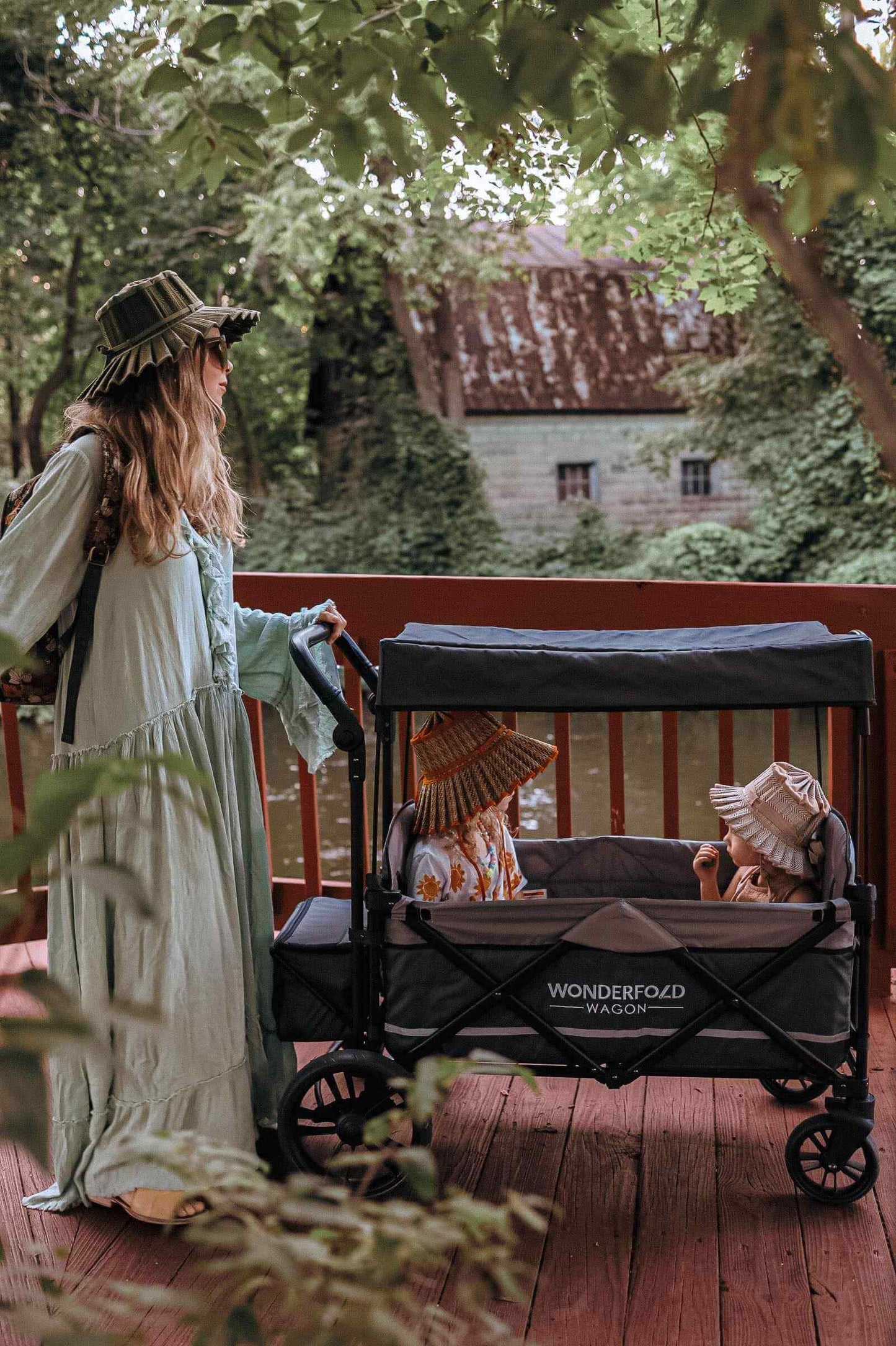 X2 Double Stroller Wagon - Lifestyle Image of Mother with Toddler's on X2 Double Stroller Wagon Gray