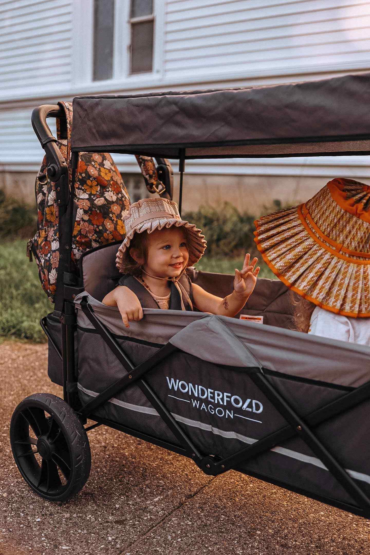 X2 Double Stroller Wagon - Zoomed Lifestyle Image of Toddler's on X2 Double Stroller Wagon Gray