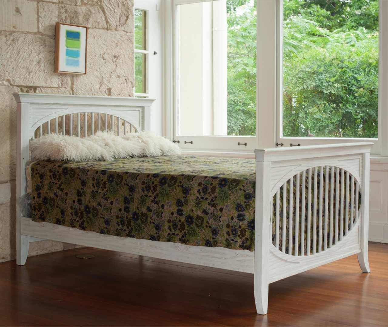 Cameo Oval Convertible Crib - Lifestyle Image Side View of Oval Toddler Bed Steam