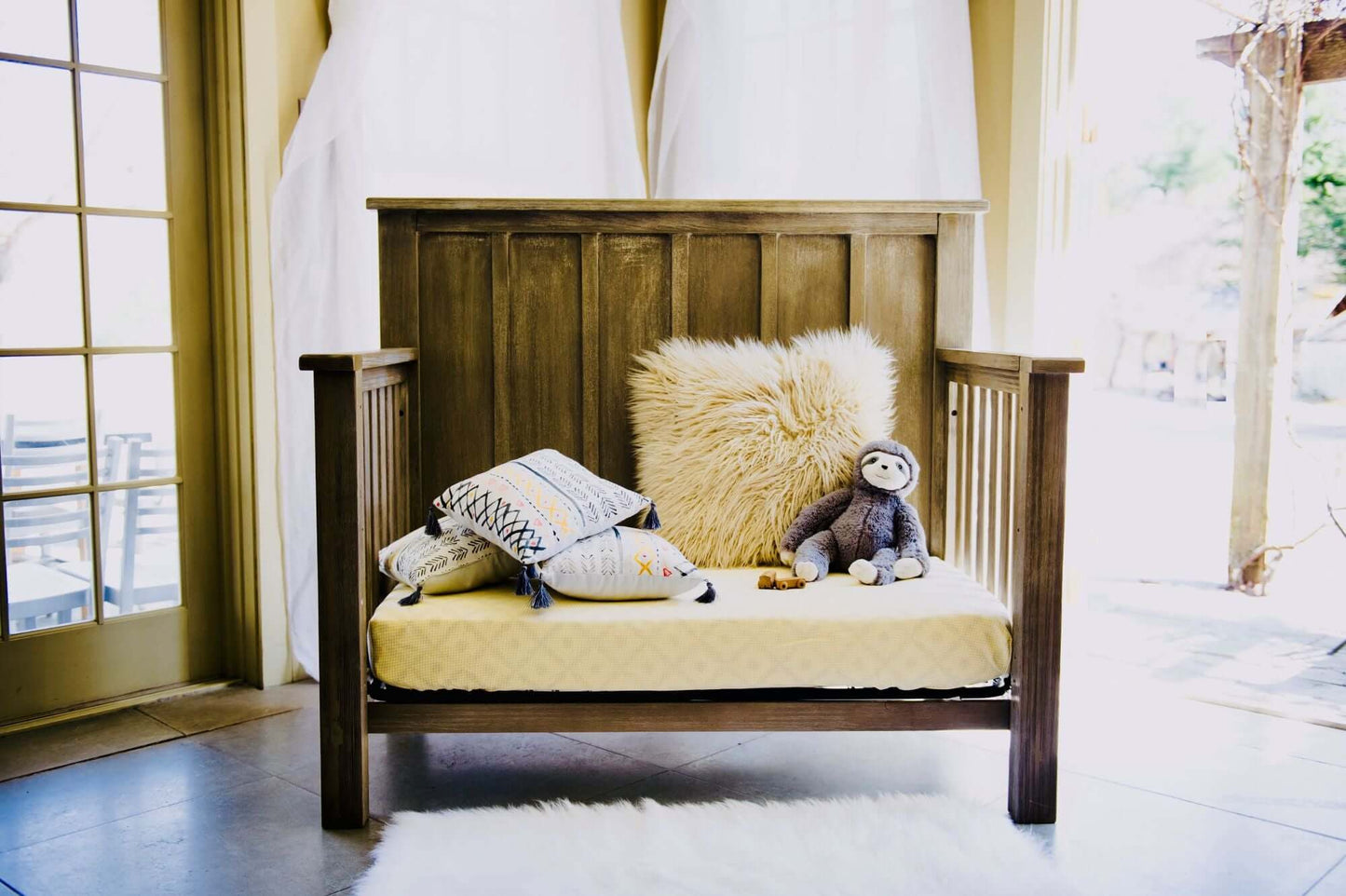 Relic Batten 4-in-1 Convertible Crib - Lifestyle Image of Batten Daybed Fossil