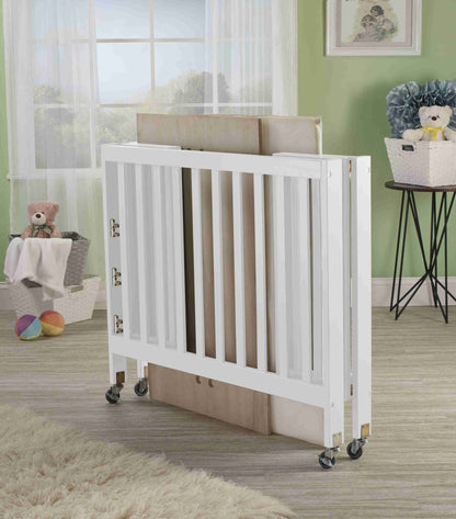 Roxy Three Level Mini Portable Folding Crib - Lifestyle Image of Mini Portable Crib Collapsed White