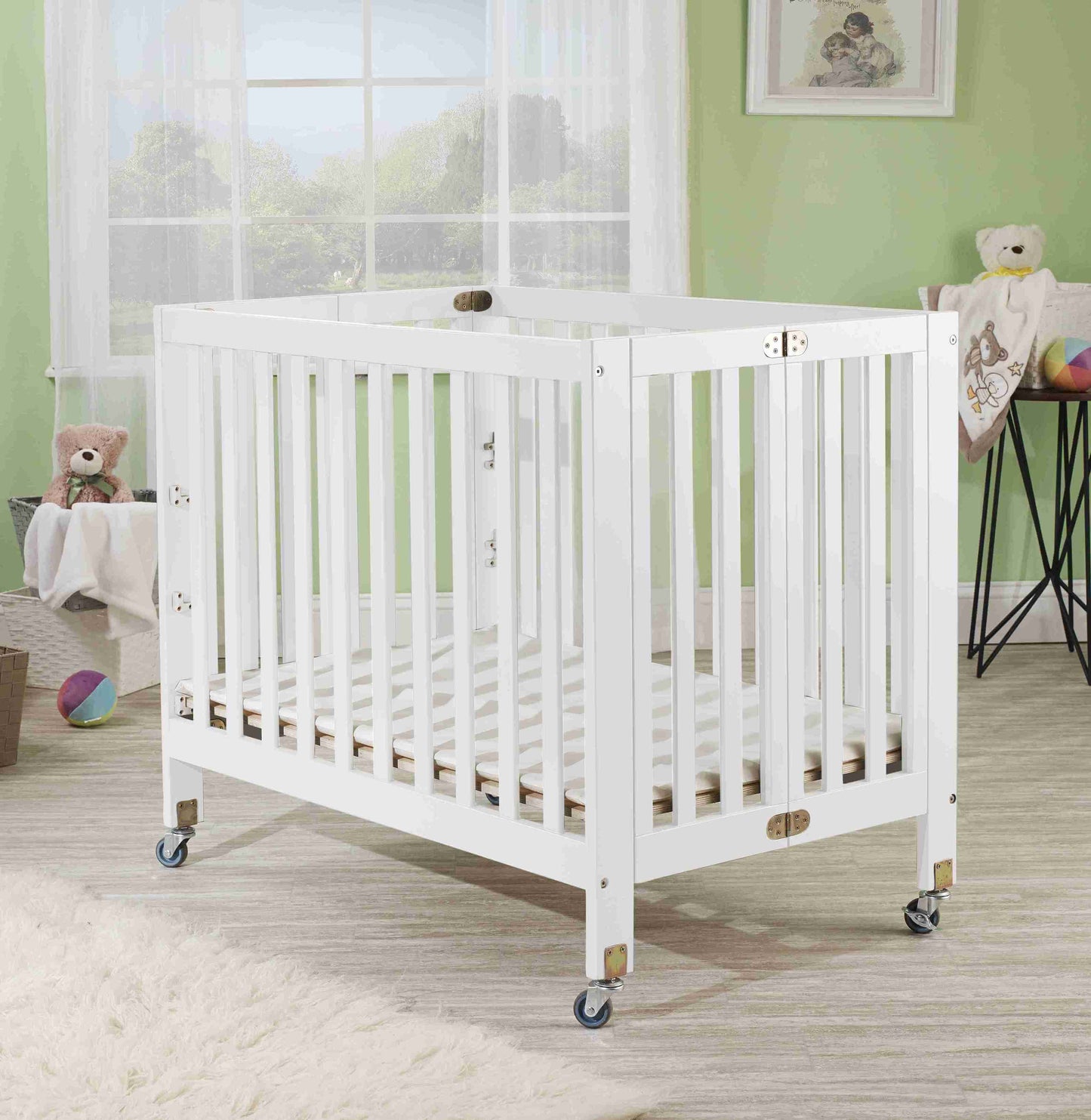 Roxy Three Level Mini Portable Folding Crib - Lifestyle Image of Mini Portable Crib White-1