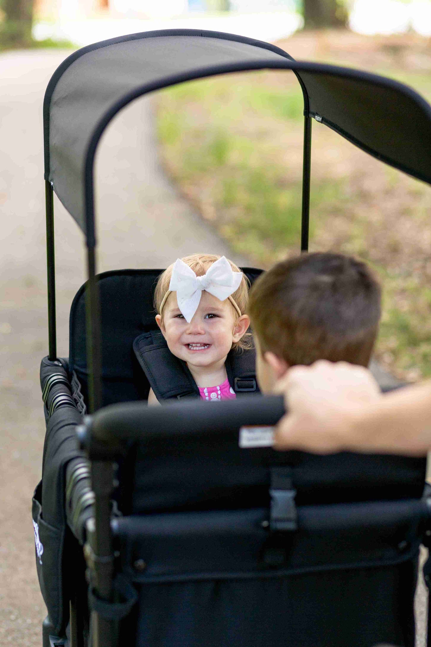 W2 Original + Double Stroller Wagon - Zoomed Lifestyle Image of Toddler on W2 Original + Double Stroller Wagon Black